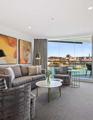 the living room interior of a Deluxe Harbour View Suite at Pullman Quay Grand Sydney Harbour