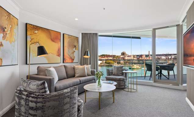 the living room interior of a Deluxe Harbour View Suite at Pullman Quay Grand Sydney Harbour