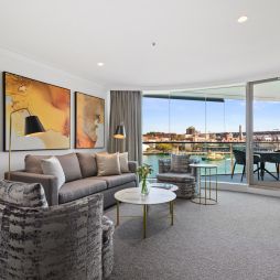 the living room interior of a Deluxe Harbour View Suite at Pullman Quay Grand Sydney Harbour