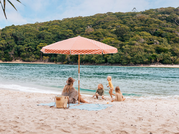 a family relaxing at Tallebudgera Creek