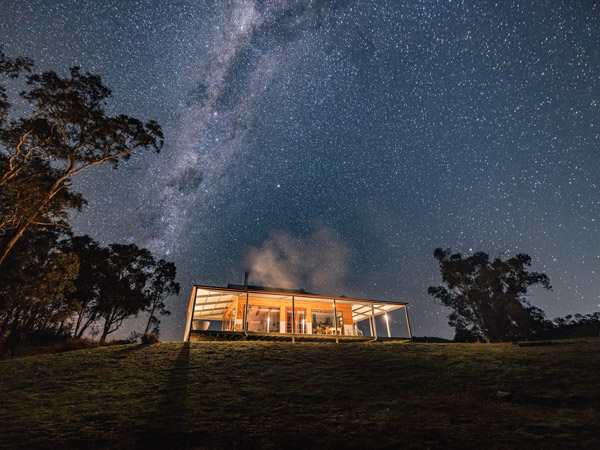 Kestrel Nest EcoHut at night with Milky Way above