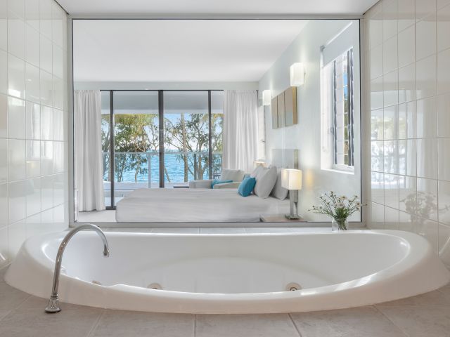 a spa tub with ocean views at Drift Palm Cove