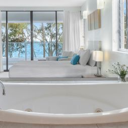 a spa tub with ocean views at Drift Palm Cove
