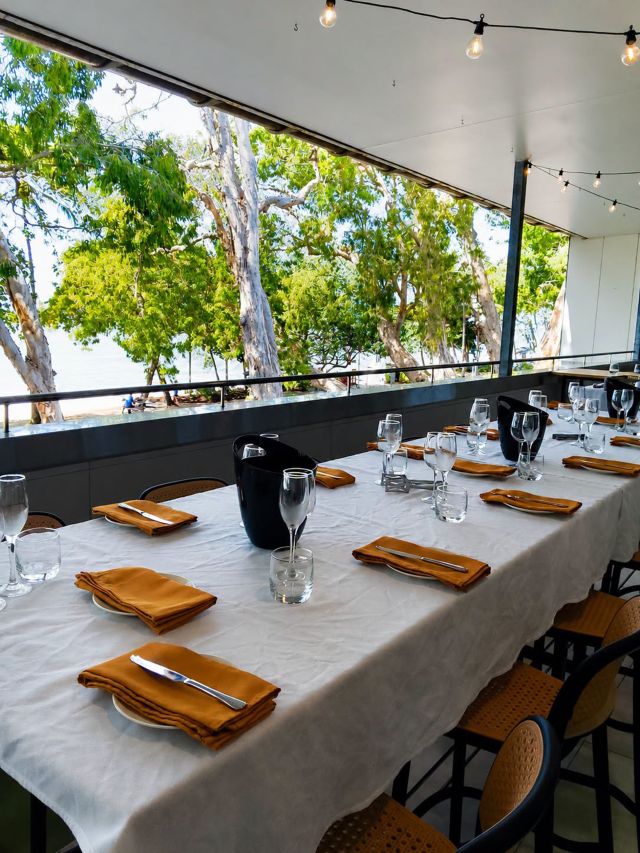a long table dining setup at Cairns Surf Club Palm Cove