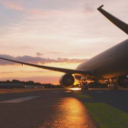 plane about to take off at sunset