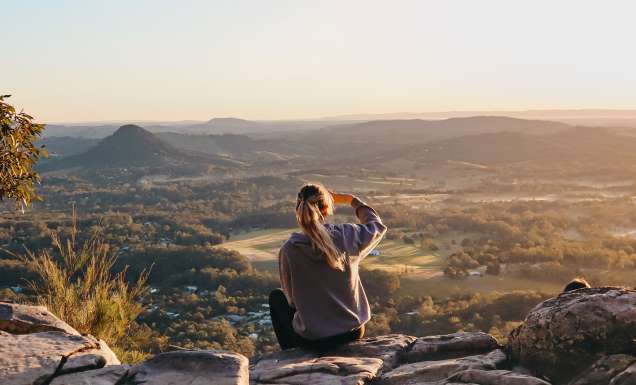woman enjoying the view after hiking through Noosa National Park, noosa in winter