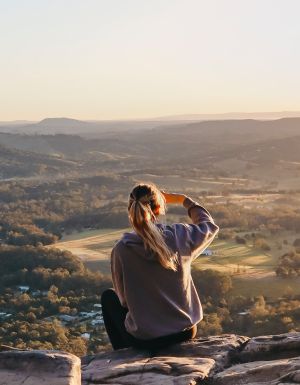 woman enjoying the view after hiking through Noosa National Park, noosa in winter