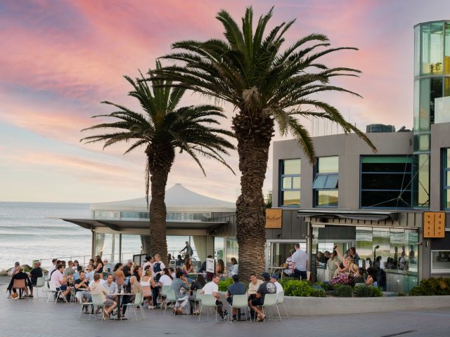 people dining al fresco at sunset in Next Door Cronulla