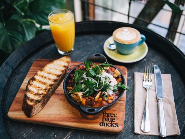 breakfast with coffee and juice at Three Blue Ducks