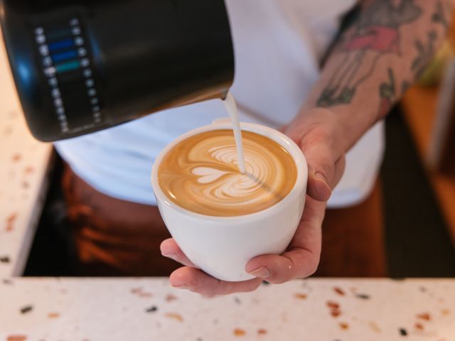 making latte art at Solstice, Sydney cafe