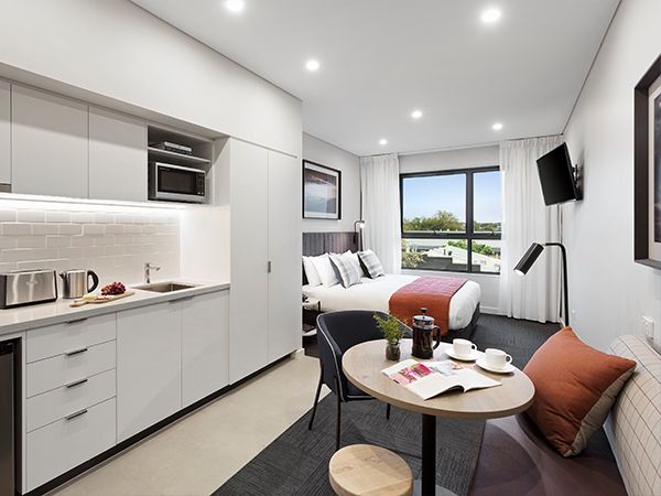 A studio room with a kitchen at Quest Orange.