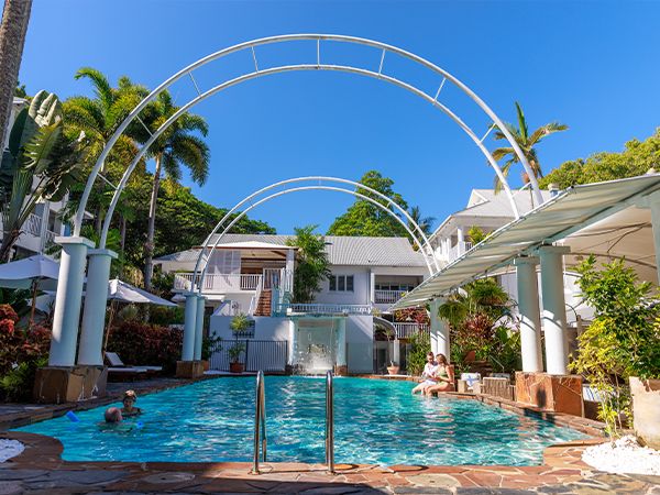 An outdoor swimming pool at a hotel.