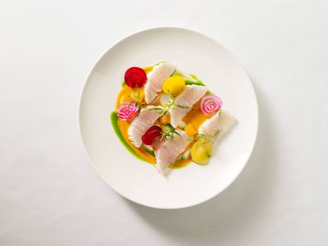 a delicate, fine-dining crudo dish at Tamarind Restaurant