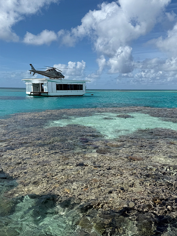 A pontoon with a helicopter in the Great Barrier Reef.