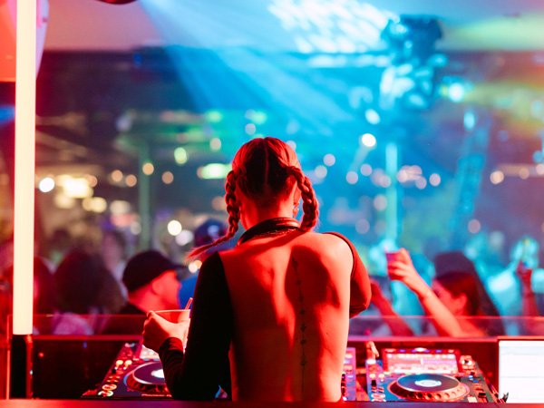 a DJ sets the party mood at Bungalow 8, Sydney