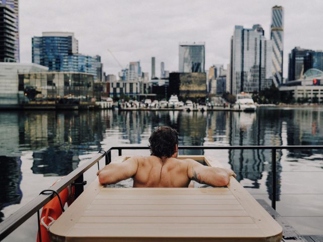 man in cold plunge bathg on sauna boat melbourne