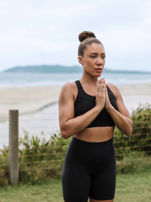 Woman doing yoga at a Winter Wellness Retreat with Elements of Byron