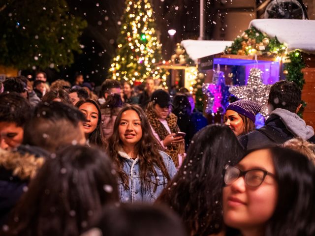 crowd and snow at Christmas in July festival in Sydney, NSW