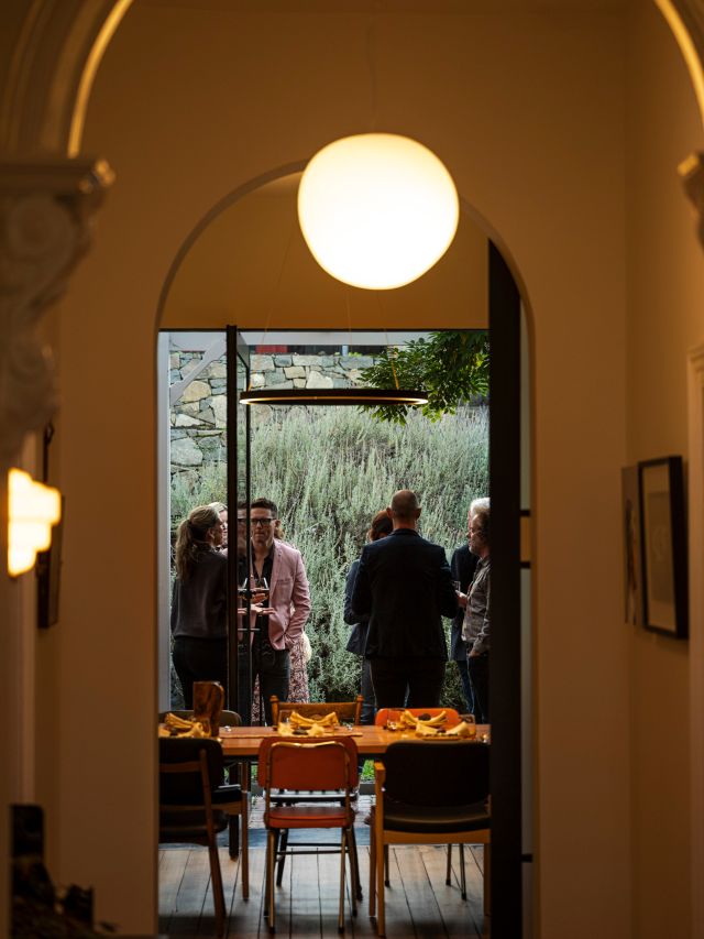 an arched hallway with pendant lighting at Scarpetta, Hobart