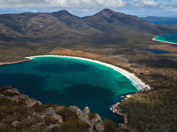 an aerial view of Wineglass Bay on a Tasmania road trip