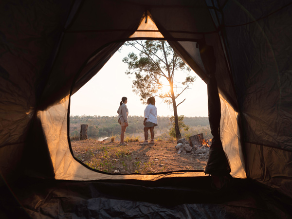 two women standing outside their tent at Seven Emu Station