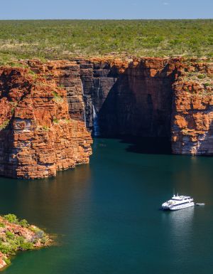 A Kimberley cruise drifts beneath King George Falls, where sheer sandstone cliffs frame the thunderous plunge into turquoise waters. Discover the best of Australia's North West cruises.
