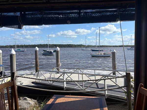 View of the water from inside Chez Basho Boatshed Cafe in Iluka