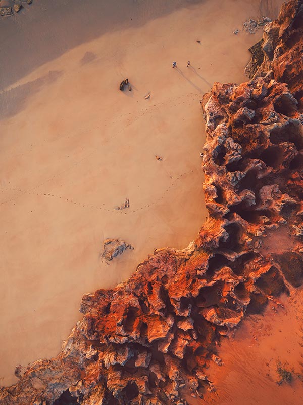 aerial of people walking on eco beach in the kimberley western australia
