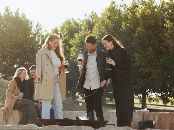 Friends by the firepit at The Lane Retreat