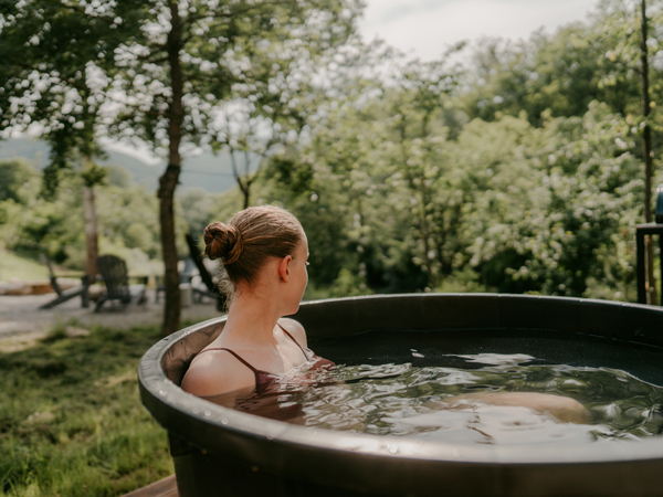Woman doing an ice plunge bath