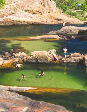 People swimming in Gunlom Falls