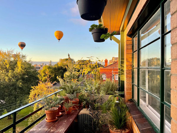 scenic views from the Two Bedr Art Deco Flat with hot air balloons and lush greenery in the background