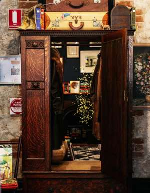 girl walking into wardrobe at Paper Bird book store in fremantle WA