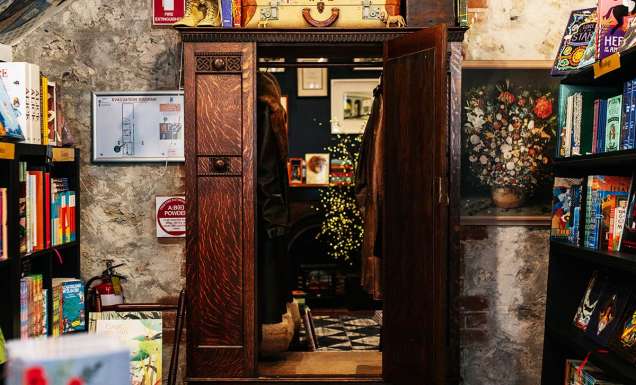 girl walking into wardrobe at Paper Bird book store in fremantle WA