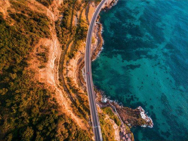 aerial of sea cliff bridge along grand pacific drive nsw