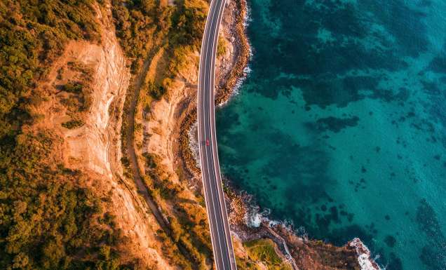 aerial of sea cliff bridge along grand pacific drive nsw