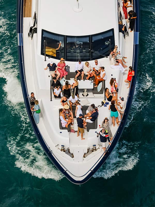 spectators on a superyacht in hamilton island race week