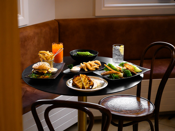 food and drinks on the table at Tides Cafe, Bar & Restaurant, Great Ocean Road itinerary