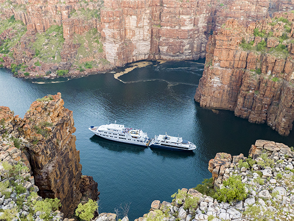 The True North Adventure Cruise in between sandstone cliffs.
