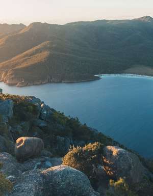 person hiking in Wineglass Bay in tasmania