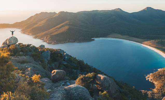 person hiking in Wineglass Bay in tasmania