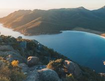 person hiking in Wineglass Bay in tasmania