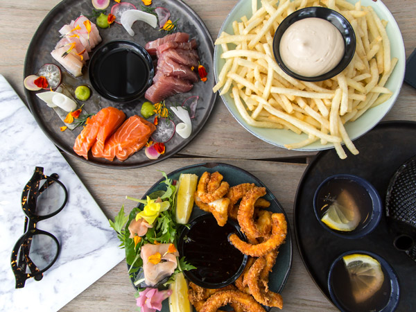 a spread of food at Barbados Restaurant and Bar, Port Douglas pubs