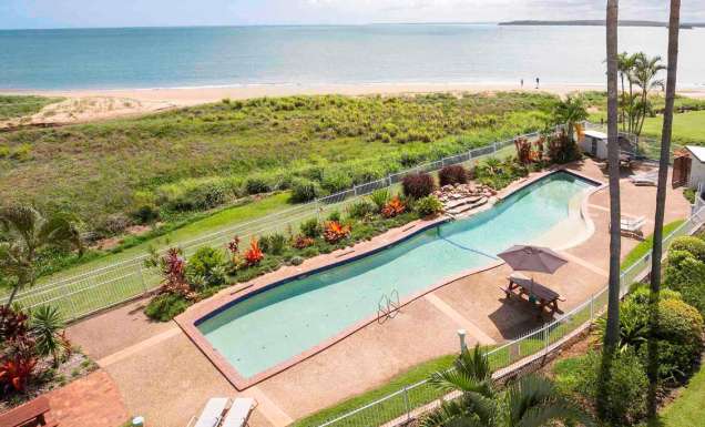 A resort swimming pool with views to the ocean