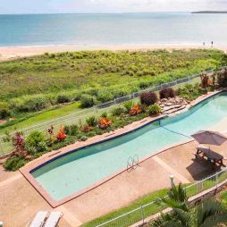 A resort swimming pool with views to the ocean