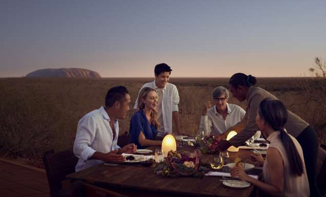 A table of people dining at Tali Wiṟu in Uluṟu
