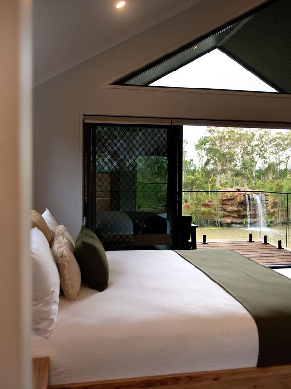 The bedrooms give views of the lagoon at Crocodile Cabins