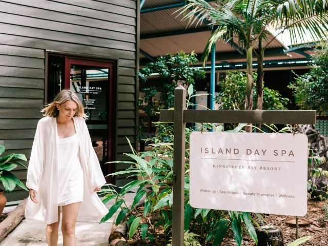 woman walking outside kingfisher bay resort Island Day Spa
