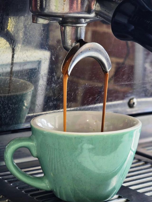 pouring espresso into a cup at Phat Milk
