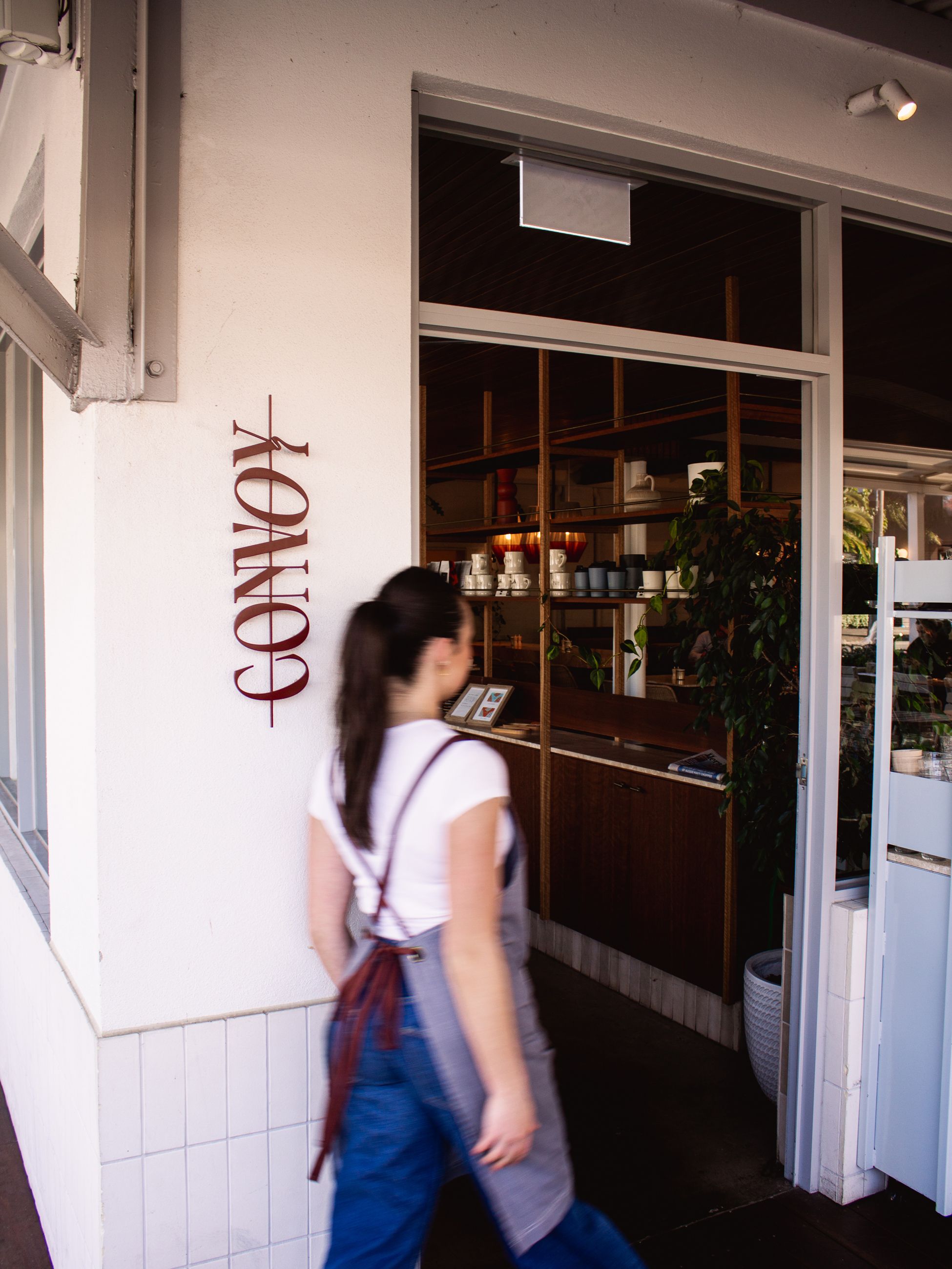 a cafe staff entering Convoy, Melbourne